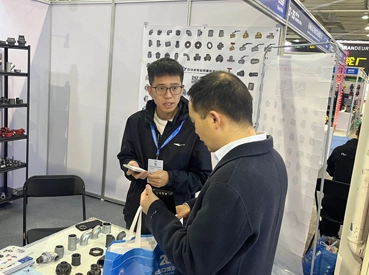 Business Negotiation with Client at Exhibition Booth Business Negotiation with Client at Exhibition Booth